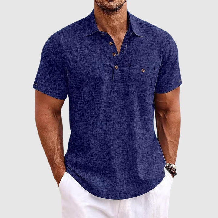 "Men's textured polo shirt with chest pocket, short sleeves, turn-down collar, and relaxed fit for warm-weather comfort."