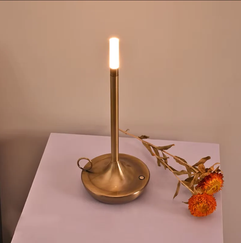 "Modern cylindrical rechargeable touch table lamp with adjustable brightness, ideal for ambient lighting in any space."
