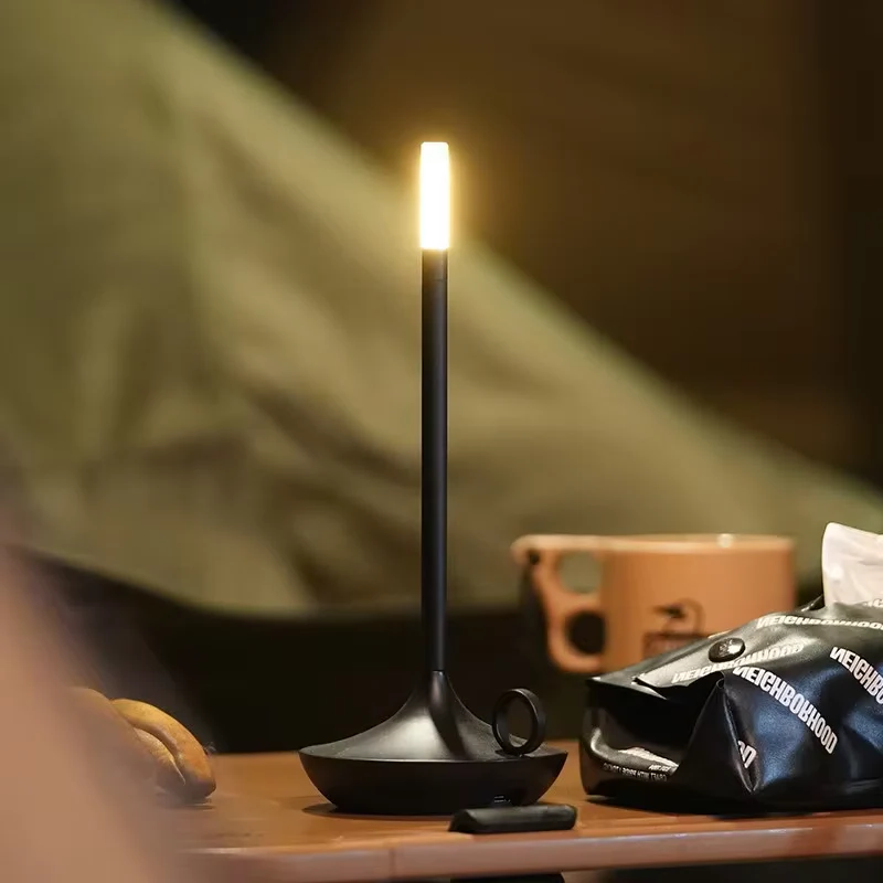 "Modern cylindrical rechargeable touch table lamp with adjustable brightness, ideal for ambient lighting in any space."
