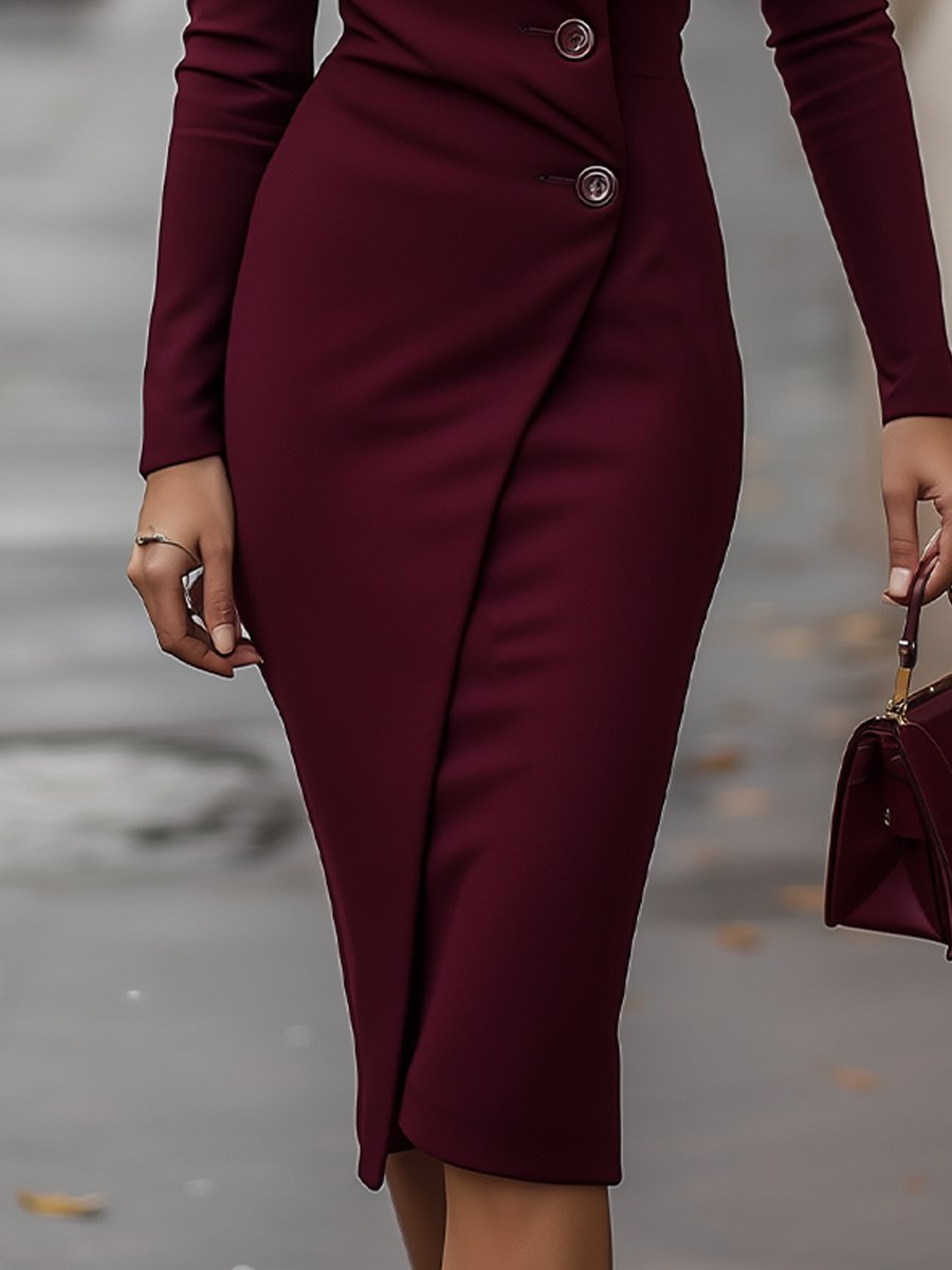 Close-up of the button detail on a women's navy wrap midi dress, featuring a flattering silhouette