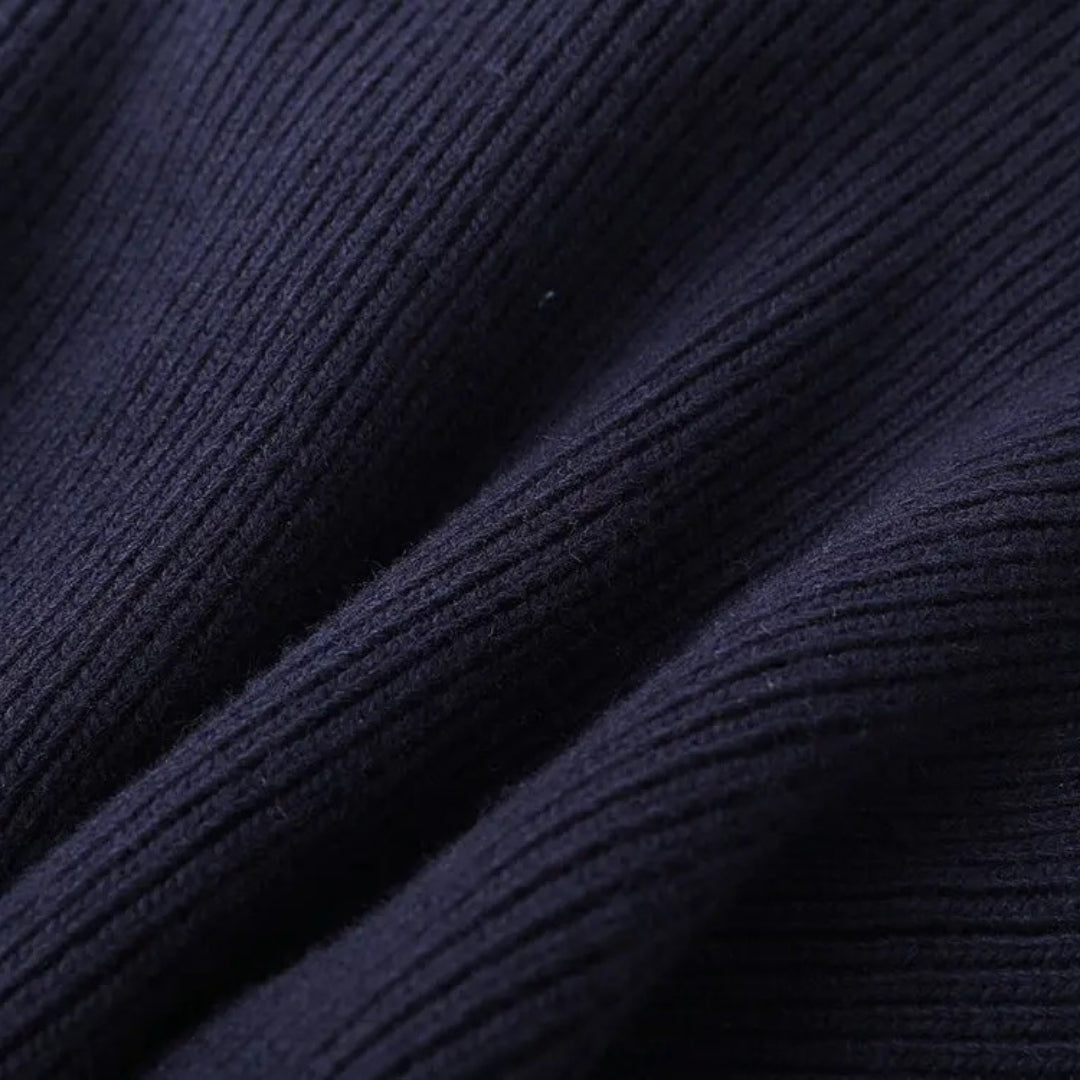 Detailed back view of a women's navy layered cardigan jacket, versatile spring attire.