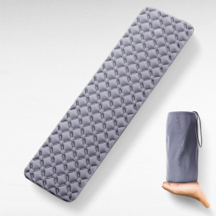 Compact, portable air mattress for camping, easy-to-inflate sleep pad for comfortable outdoor adventures.