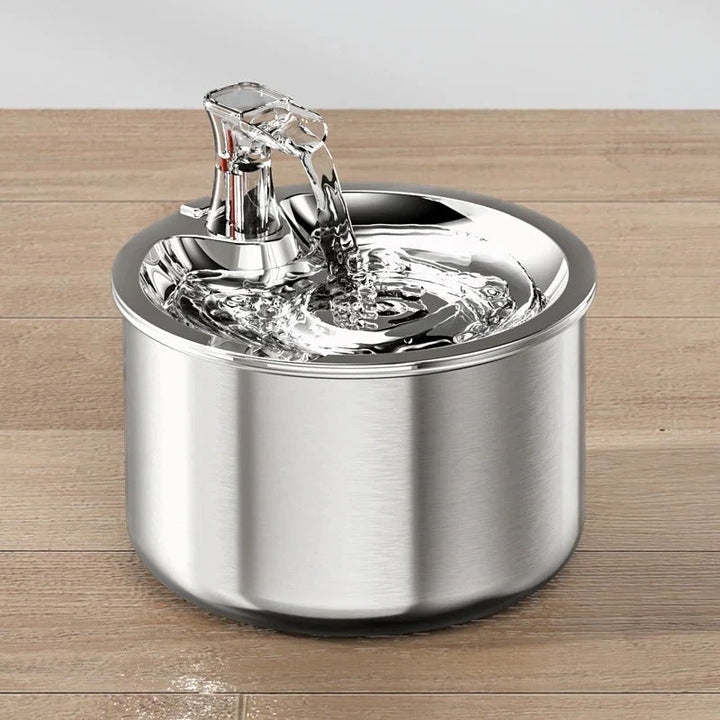 Modern stainless steel pet fountain for cats & dogs, features filter, motion sensor, and promotes optimal pet hydration.