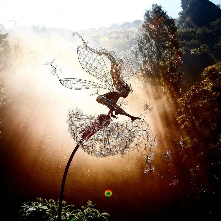 Whimsical metal fairy silhouette on a dandelion garden stake, perfect for outdoor yard art decor.