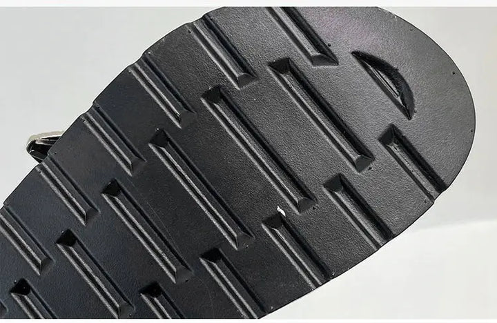Side view of women's studded platform sandals, showcasing the bold silhouette & punk style.