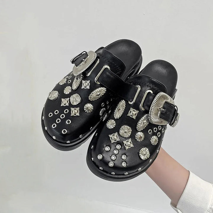 Statement women's studded platform sandals, offering edgy style and elevated comfort.