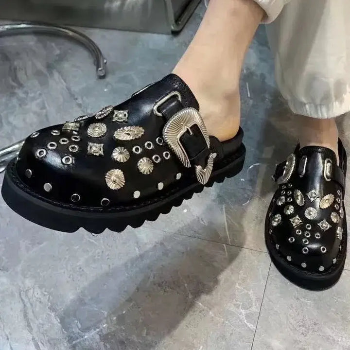 Women's fashion-forward studded platform sandals, blending punk style with comfort.