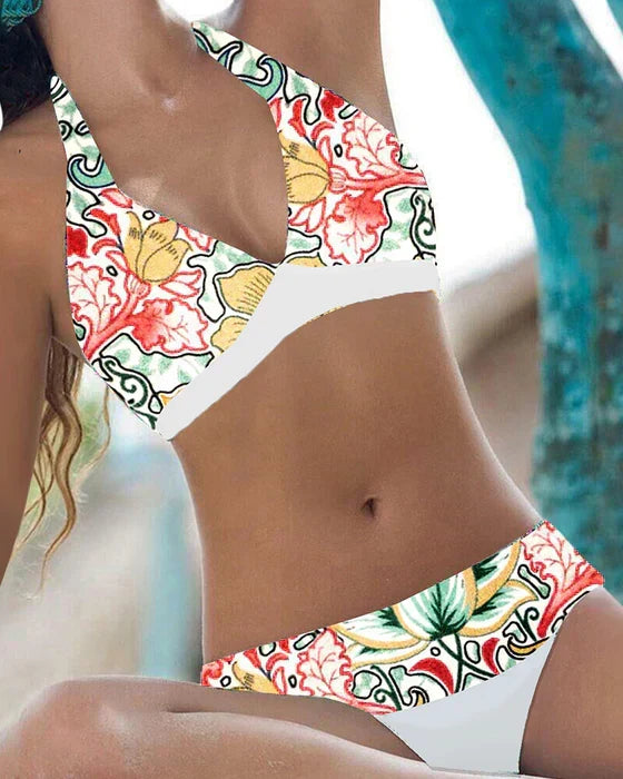 Women's playful floral & polka dot bikini swimsuit for summer beach & pool days.