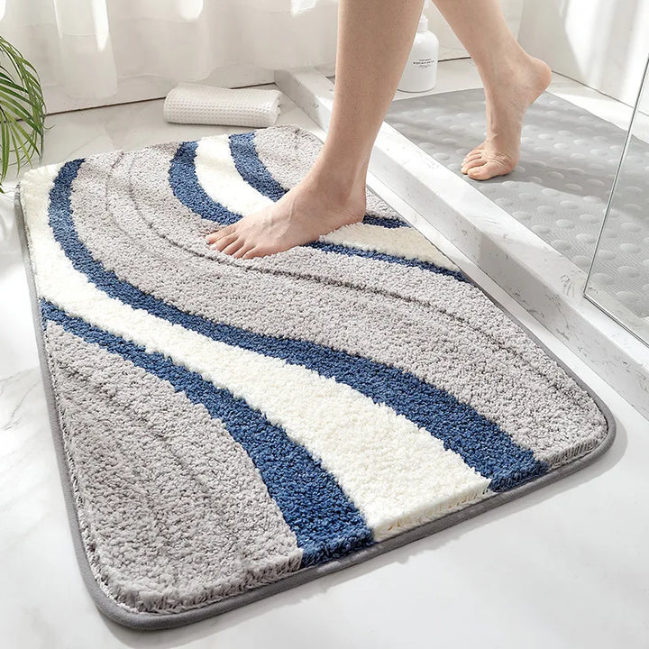 Weave blue plush microfiber bath rug, soft & absorbent. Non-slip for spa-like bathroom comfort.