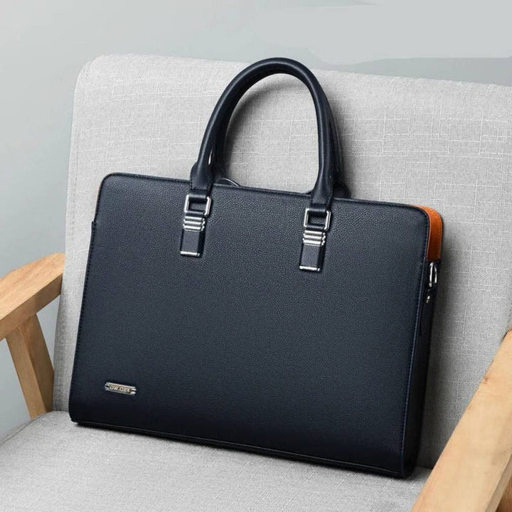 Organized men's travel messenger bag. Securely fits 14-15 inch laptops, documents & work essentials.