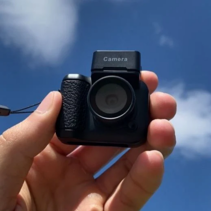 "Retro-inspired mini digital camera with vintage design, compact size, and modern features, perfect for travel photography."