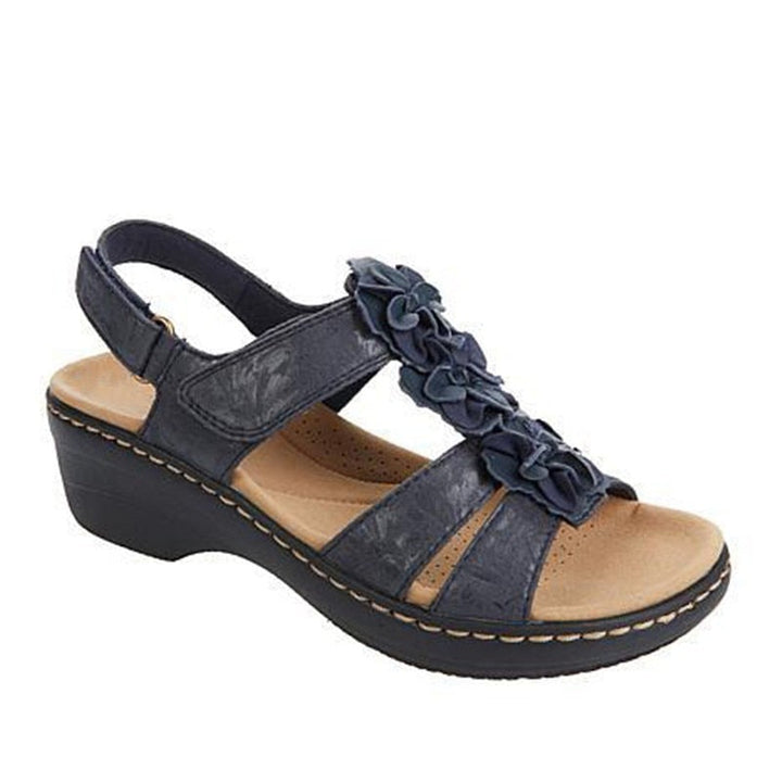 Close-up of women's retro wedge sandals, showcasing orthopedic comfort features & strap detail.