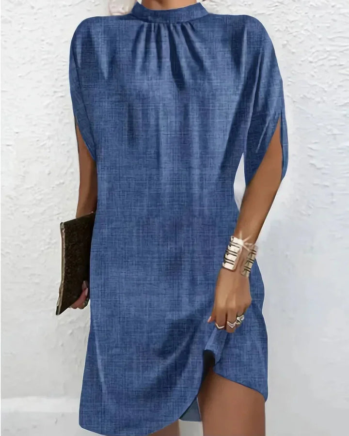 Elegant women's mock neck mini dress with stylish cape sleeves, perfect for parties.