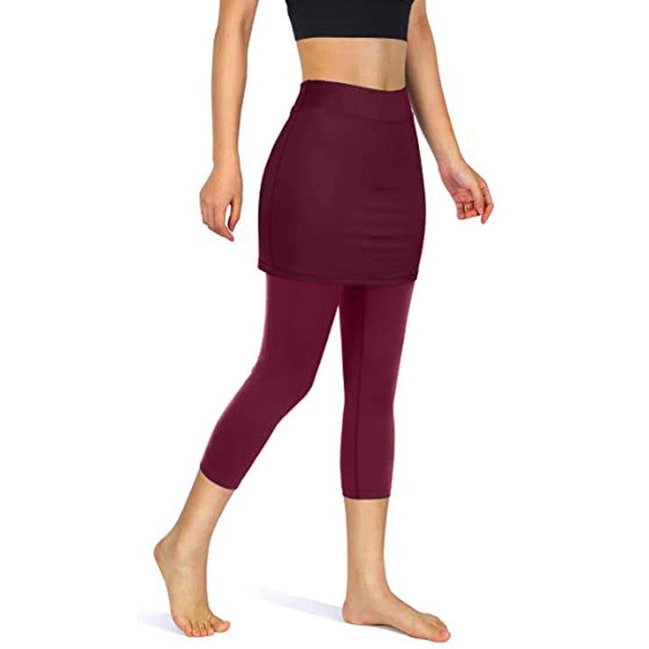 Sporty black skirted leggings for women, offering modest coverage and functional pockets.