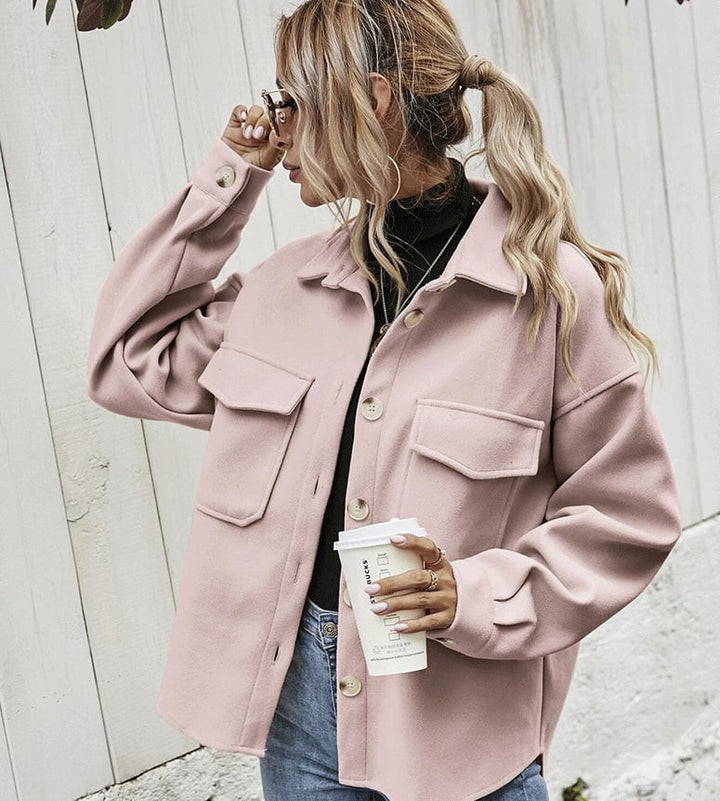 Elegant women's short beige jacket with button placket. Perfect versatile autumn outerwear for casual or office wear.