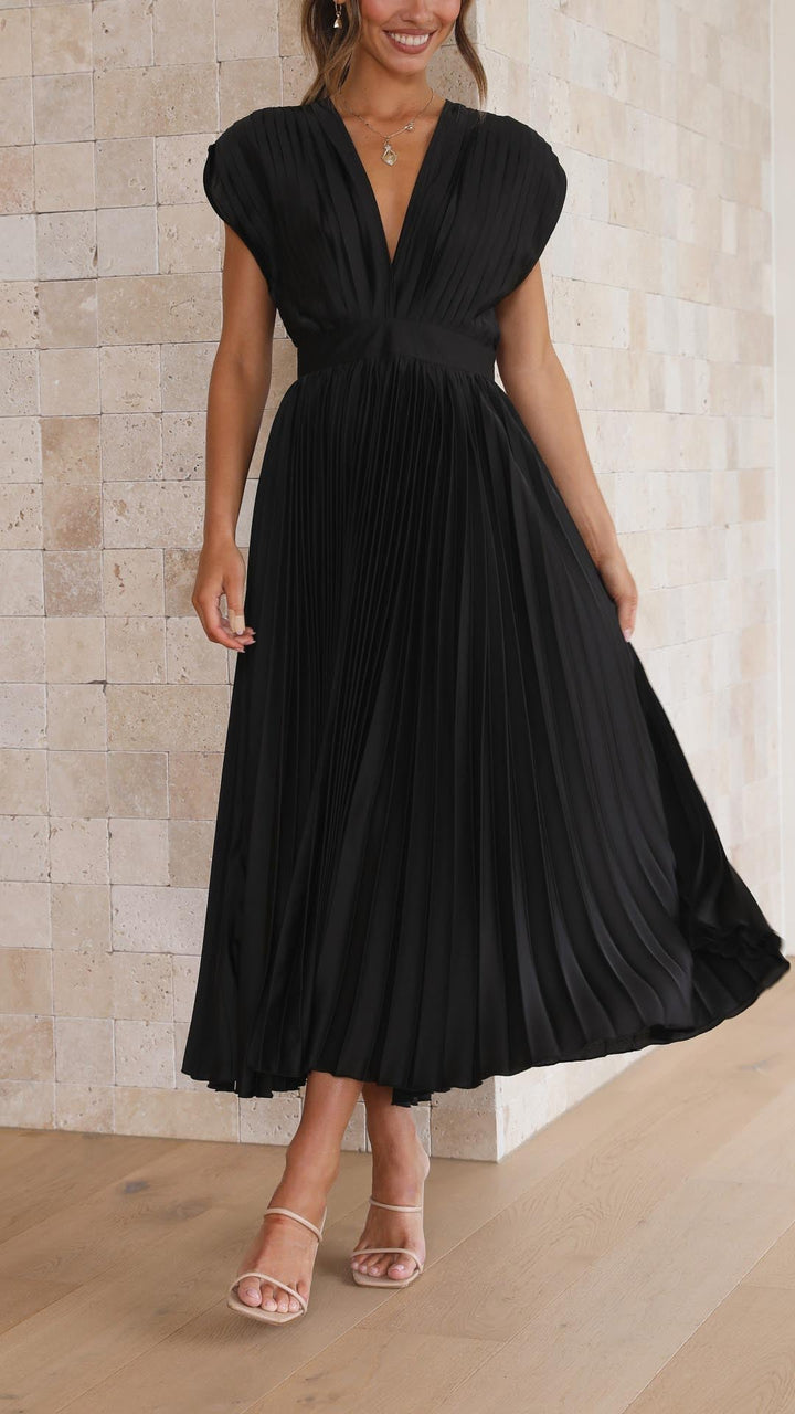 Silk pleated maxi dress with V-neck in rose red, featuring a high waist and elegant flowing pleats for a sophisticated look.