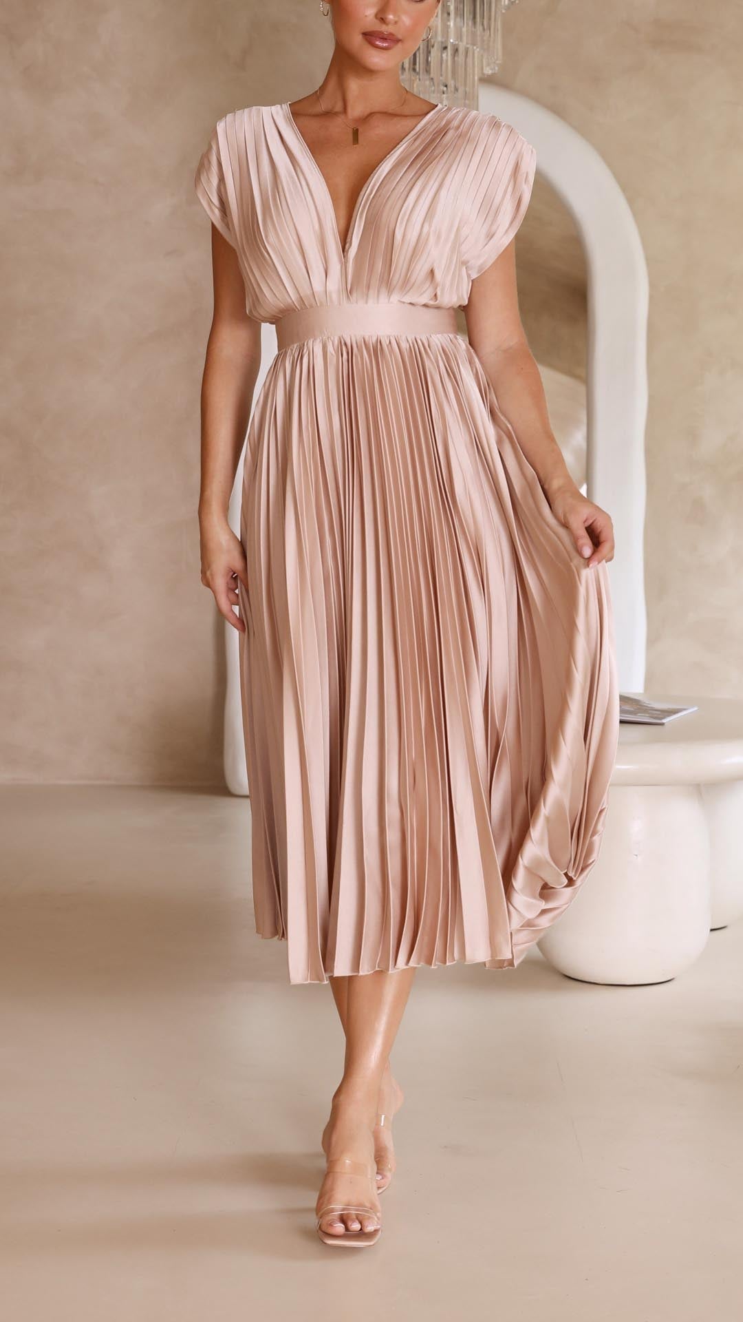 Silk pleated maxi dress with V-neck in rose red, featuring a high waist and elegant flowing pleats for a sophisticated look.