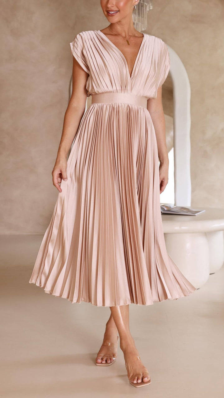 Silk pleated maxi dress with V-neck in rose red, featuring a high waist and elegant flowing pleats for a sophisticated look.