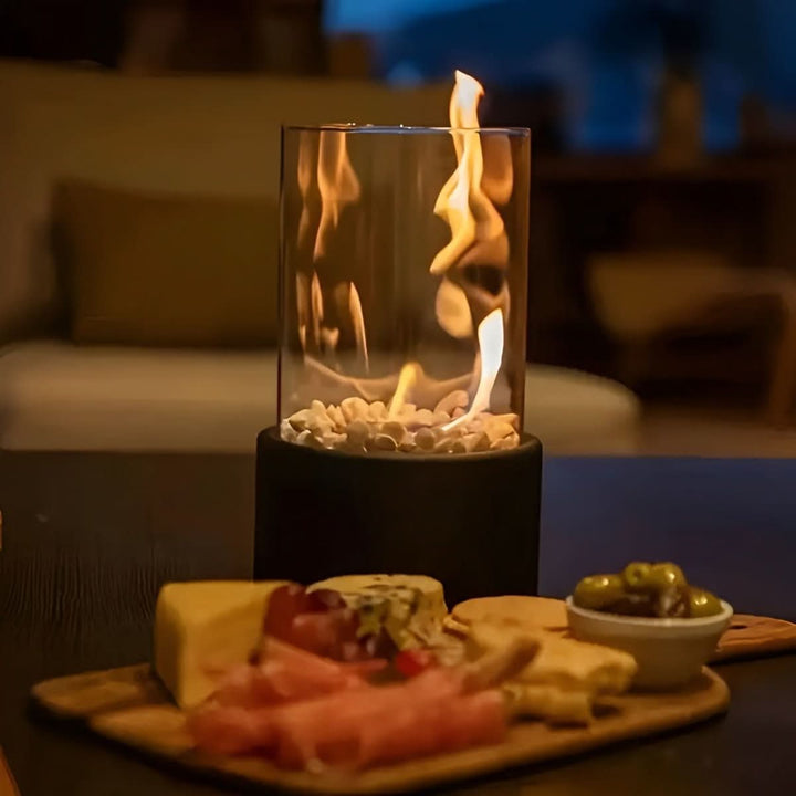 Black modern tabletop bioethanol fireplace, ideal for indoor home decor & outdoor ambiance.