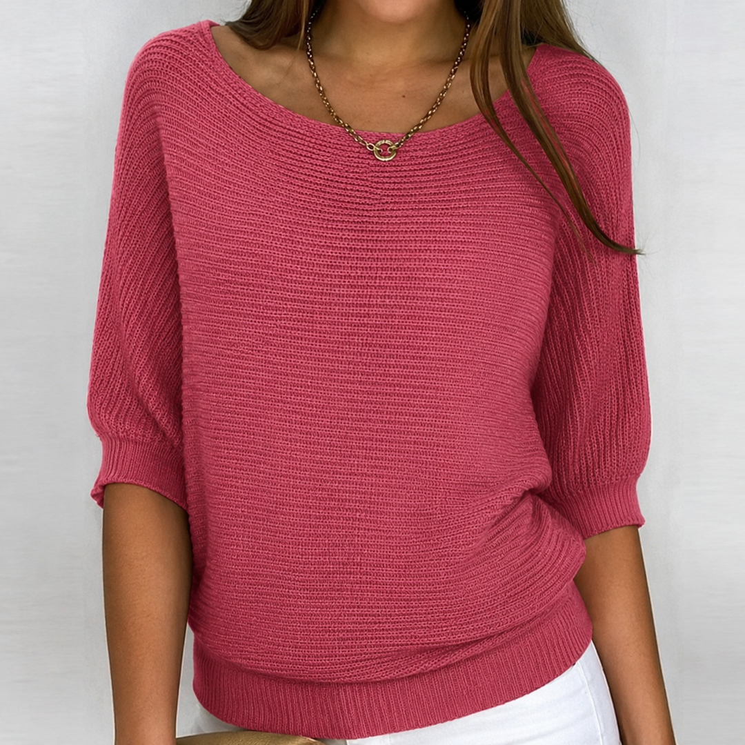 Oversized women's knit top with 3/4 sleeves, crafted from soft fabric for a comfortable, versatile spring or fall style.