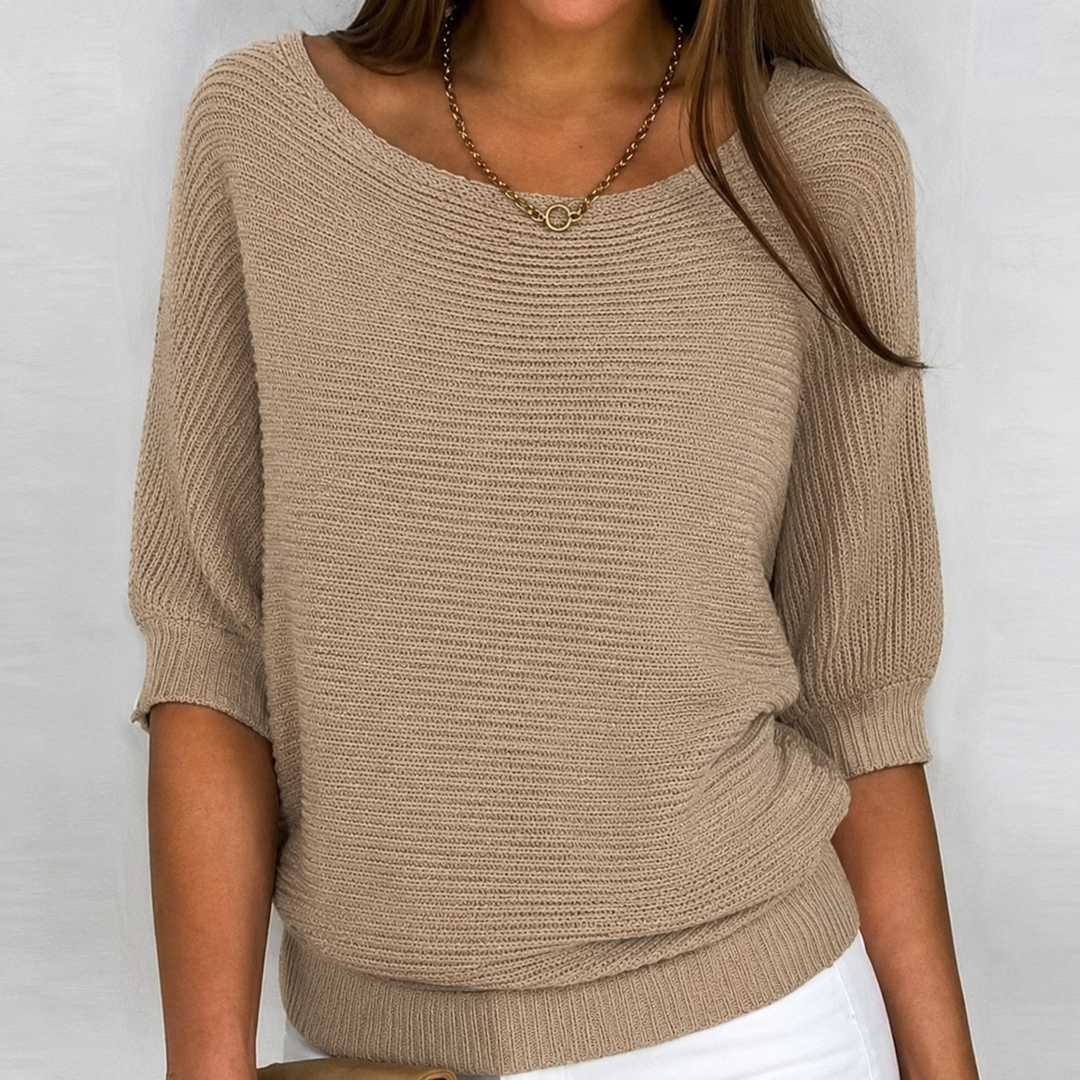 Effortless women's 3/4 sleeve knit sweater, ideal for casual wear, offering soft comfort and a relaxed, versatile fit.