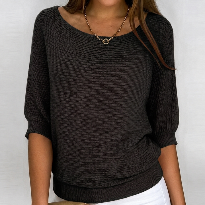 Cozy women's knit sweater with 3/4 sleeves, featuring a relaxed fit for all-day comfort, suitable for spring & fall fashion.