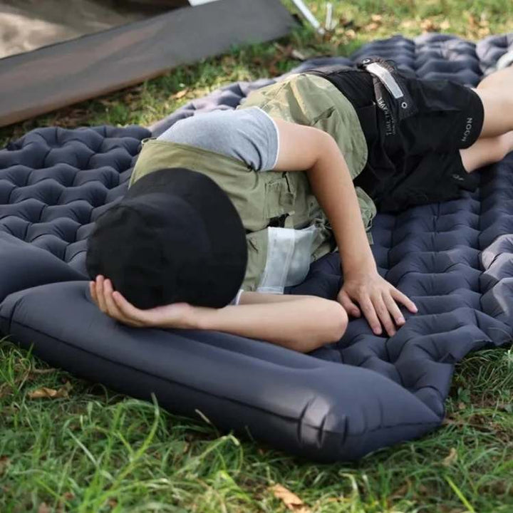 Portable inflatable light blue double air mattress, ideal for outdoor camping & travel comfort.