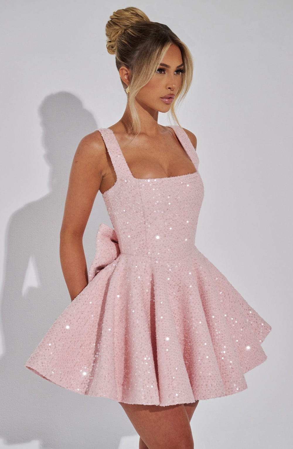 Glamorous women's sparkling short dress with a backless bow. Perfect for evening events & special occasions.