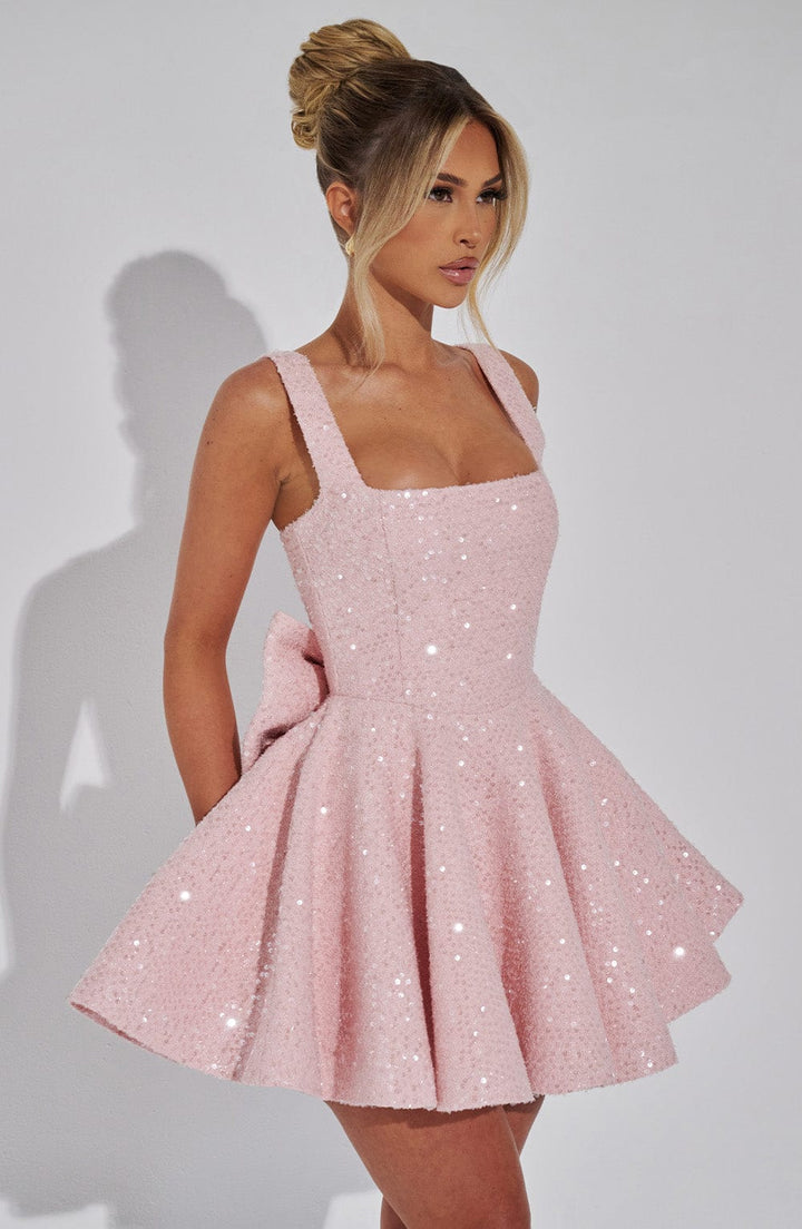 Glamorous women's sparkling short dress with a backless bow. Perfect for evening events & special occasions.