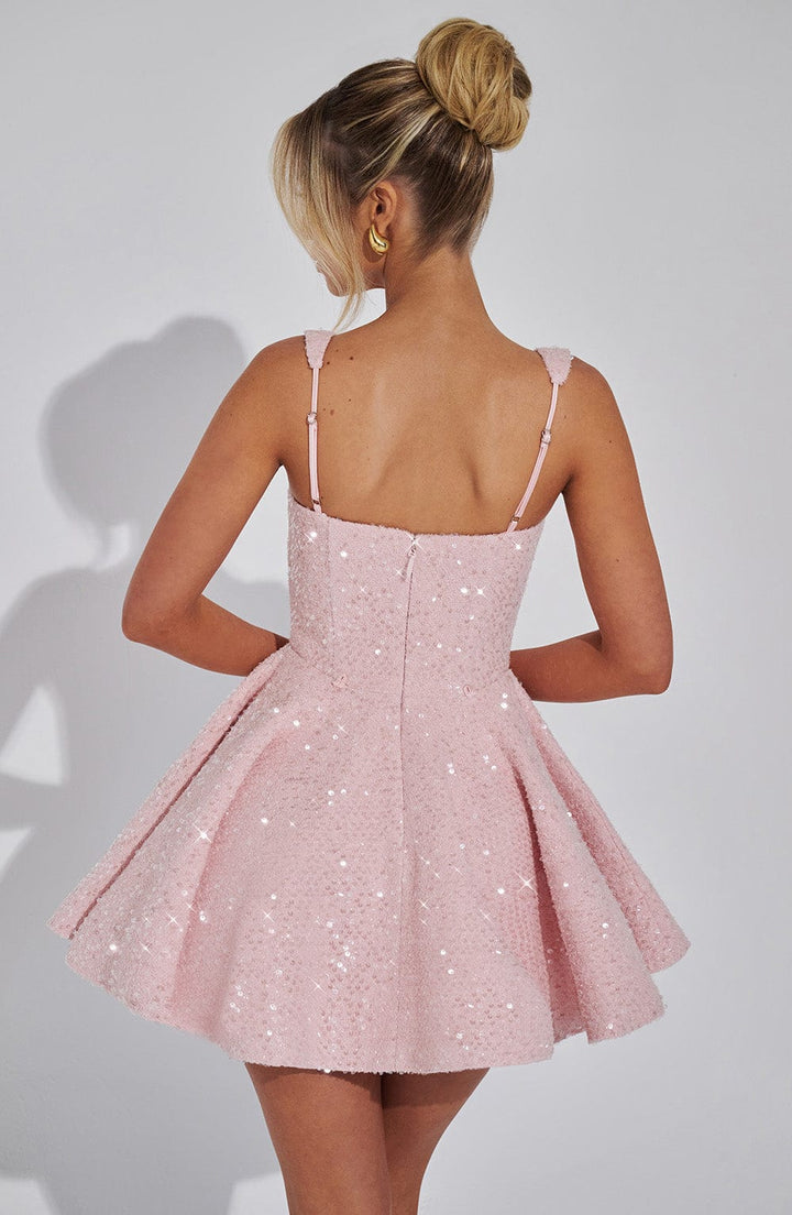 A-line sparkling backless mini dress for women with a statement bow. Perfect for glamorous cocktail parties.