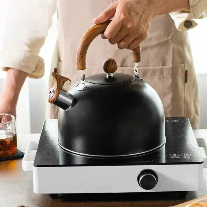 Sleek stainless steel stovetop kettle, durable and rust-resistant, with a comfortable insulated handle.