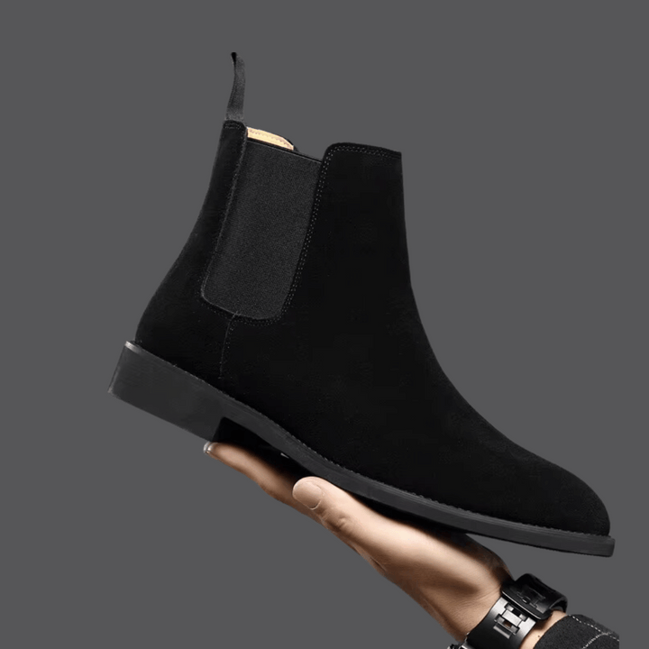 Modern men's stylish Chelsea boots, comfortable and versatile footwear for casual or formal occasions.