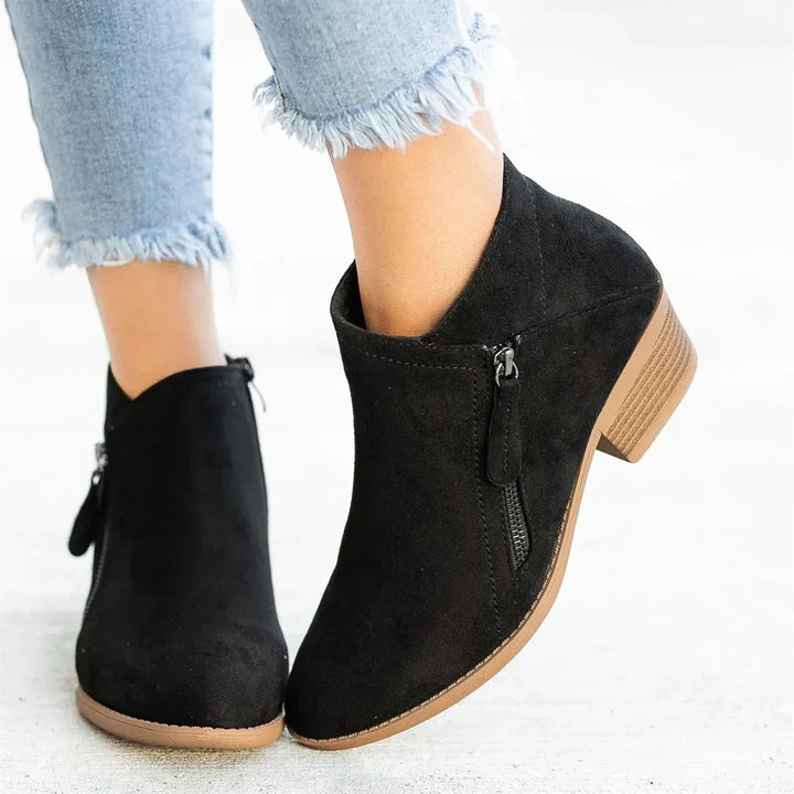Fashionable orange zip heel ankle boots for women, a stylish choice for a modern, comfortable look.