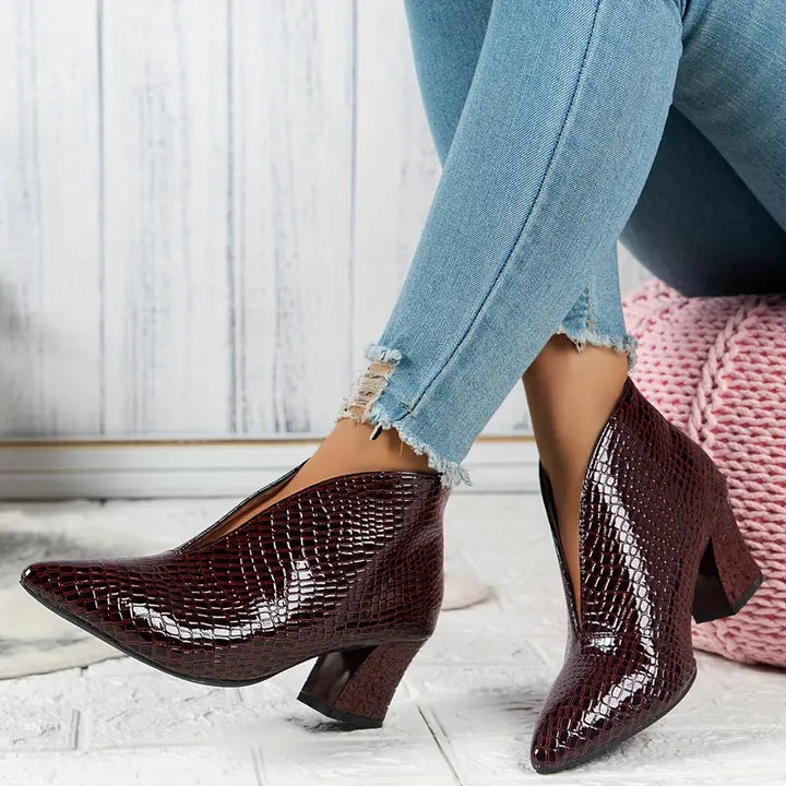 Comfortable women's ankle boots in versatile reptile print, ideal for adding flair to any look.