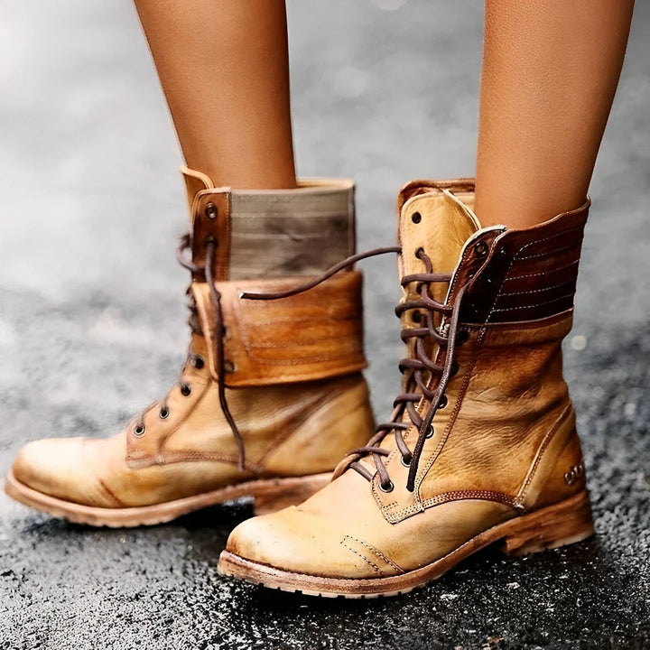 Close-up of women's combat boots with detailed lacing and durable sole, perfect for winter style