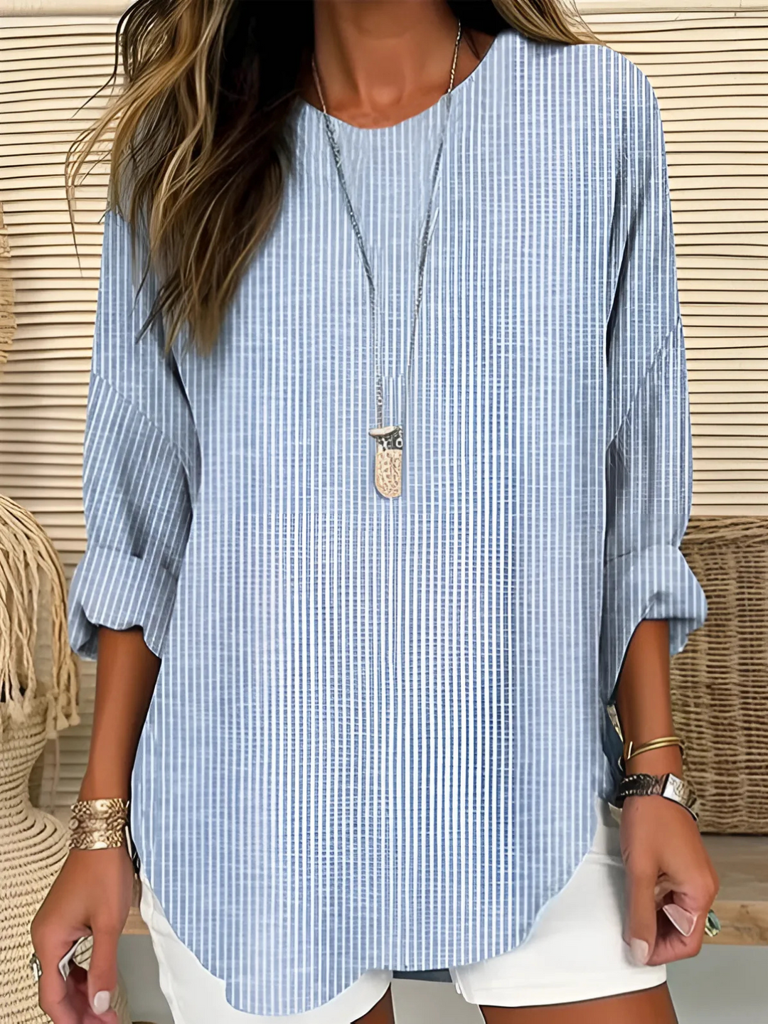 Stylish women's blue vertical stripe long sleeve blouse with round neck, perfect for casual or office wear.