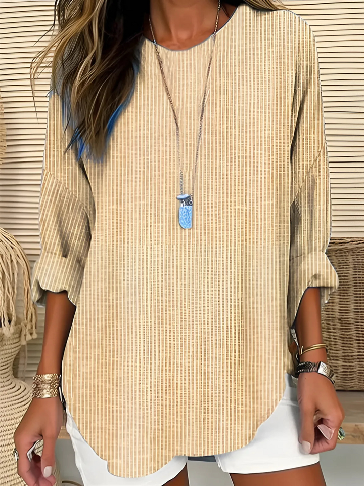 Comfortable yellow vertical stripe long sleeve blouse for women, a versatile round neck top for modern fashion.