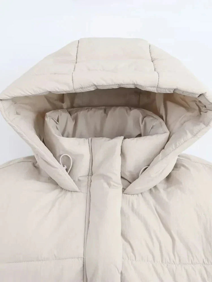Fashionable women's cropped puffer jacket, insulated and waterproof, great for cold weather
