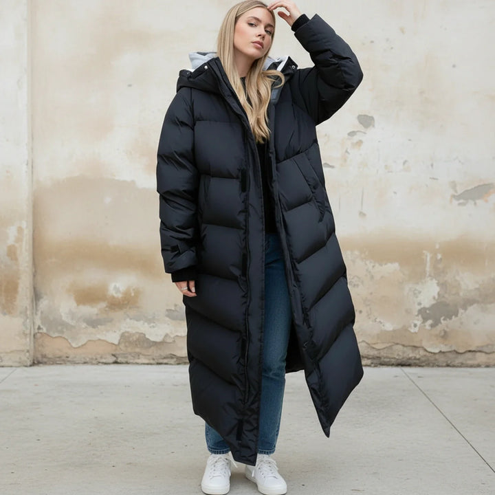 Insulated long puffer coat for women. Warm hooded winter jacket perfect for cold weather outdoor wear.