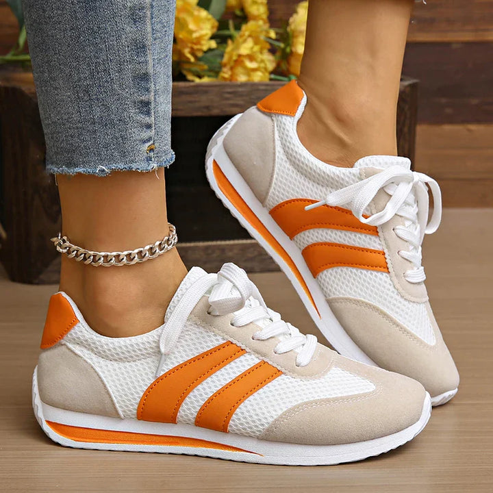 Stylish women's low-top lace-up sneakers, perfect for everyday casual wear & comfort.