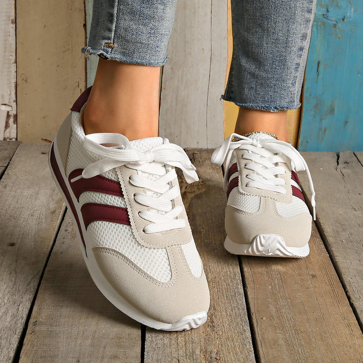 Comfortable women's walking shoes. Lace-up low-top design for sporty fashion.