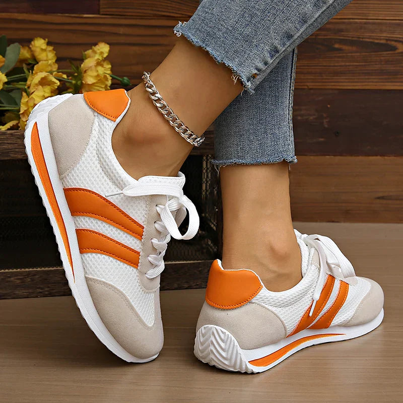 Sporty women's lace-up low-top shoes. Comfortable & stylish for active everyday wear.