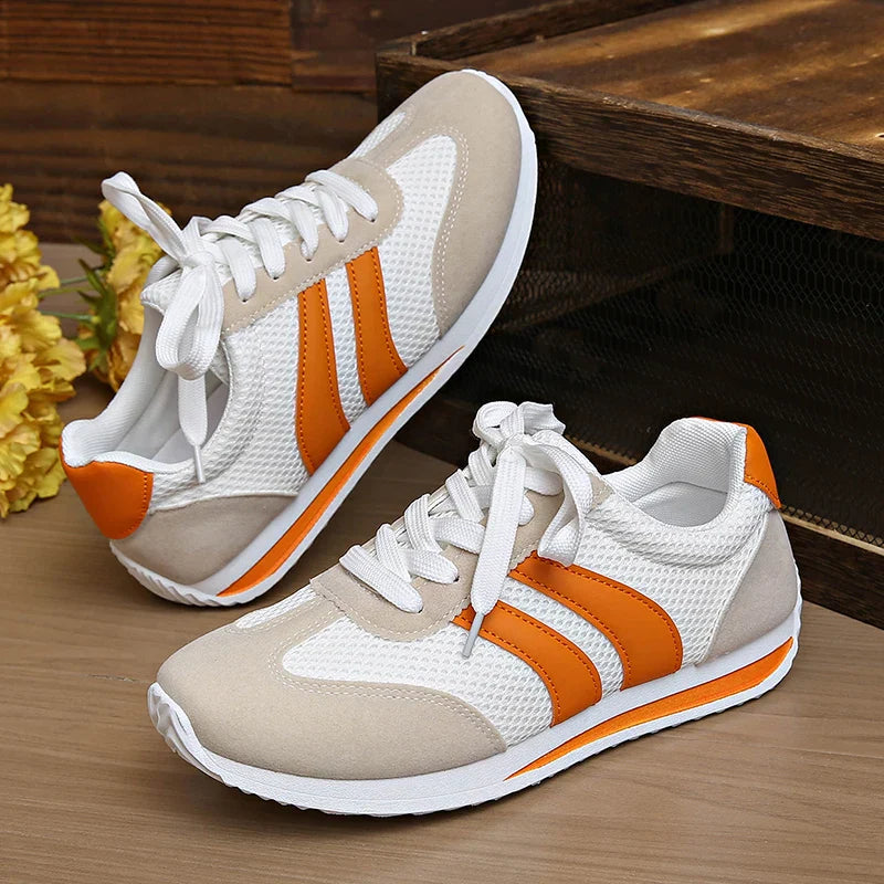 Versatile women's low-top casual sneakers. Lace-up design offers comfort for walking.