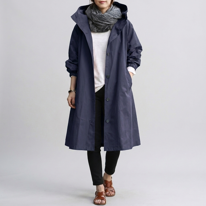 Water-resistant women's oversized hooded raincoat, long-sleeve, for ultimate wet weather protection.