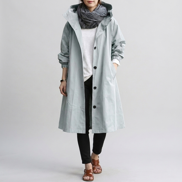 Loose-fit women's oversized rain jacket. Hooded and water-resistant for stylish and comfortable weather defense.