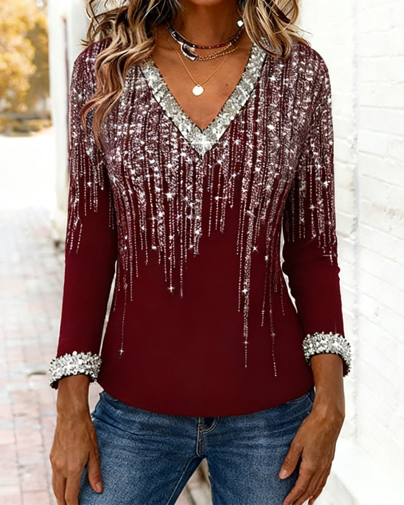 Printed women's V-neck long sleeve top for stylish casual wear. Perfect addition to fall fashion.