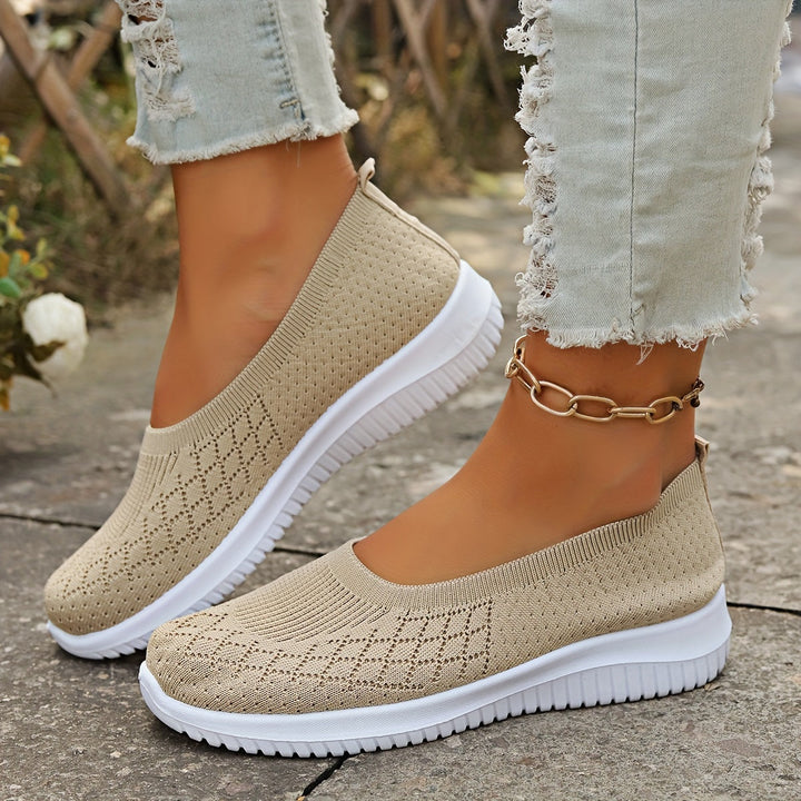 Comfortable women's slip-on footwear in a sleek design, ideal for casual fashion & easy wear. Stylish everyday shoes.