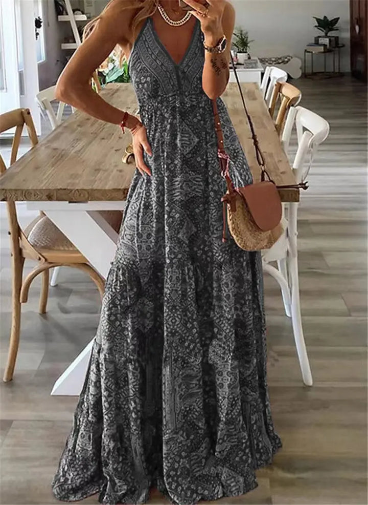 Elegant women's sleeveless floral boho maxi dress. Ideal summer vacation or party dress with a beautiful flowy print.