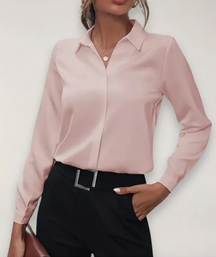 Stylish women's tailored blouse, long sleeve button-up. Perfect work shirt for a sophisticated business casual look.
