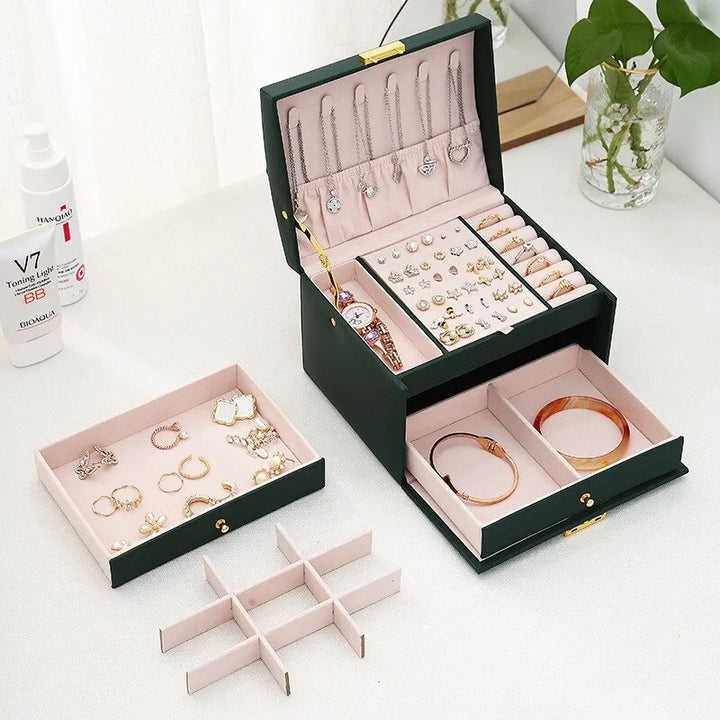 Elegant women's 3-tier jewelry storage box, velvet lined interior, for earrings, rings, and necklaces.